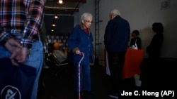 In this February 19, 2019 photo, a group of retired seniors from Laguna Woods Village attend a presentation organized by cannabis product vendors at Bud and Bloom cannabis dispensary in Santa Ana, California.