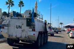 A United Nations Interim Force in Lebanon, or UNIFIL, convoy drives through the southern Lebanese city of Sidon on Nov. 14, 2024.