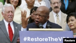 Congressman John Lewis joined several dozen other Democrats at a news conference outside the U.S. Capitol to urge restoring a shelved Voting Rights Act protection, July 30, 2015.