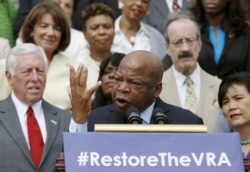 FILE - Congressman John Lewis joined several dozen other Democrats at a news conference outside the U.S. Capitol to urge restoring a shelved Voting Rights Act protection, July 30, 2015.