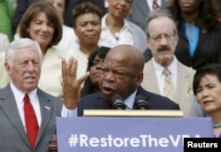 FILE - Congressman John Lewis joined several dozen other Democrats at a news conference outside the U.S. Capitol to urge restoring a shelved Voting Rights Act protection, July 30, 2015.