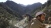 A soldier patrols the White Mountains near Tora Bora, Afghanistan, Dec. 18, 2001. 