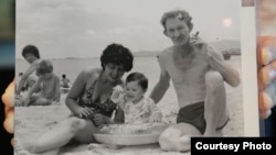 A 1984 photograph of American Charles Robert Jenkins and his wife and child on a beach. Anocha Panjoy’s family have identified her as the woman in the background.