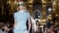 FILE - A model presents a creation by British designer Stella McCartney as part of her Spring/Summer 2016 women's ready-to-wear fashion show in Paris, France.