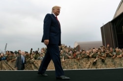 FILE - President Donald Trump arrives to speak to troops at Osan Air Base in South Korea, June 30, 2019.