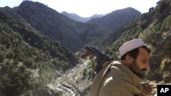 A soldier patrols the White Mountains near Tora Bora, Afghanistan, Dec. 18, 2001. 