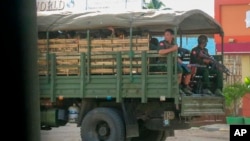 FILE - Myanmar troops and police patrol in Kayah state, eastern Myanmar, May 23, 2021. The U.N. rights office has expressed concern over recent military deployments in Chin state, Central Sagaing and Magway regions. 