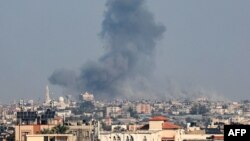 Smoke rises following Israeli strikes in Khan Yunis in the southern Gaza Strip, on December 4, 2023, amid ongoing fighting between Israel and the Palestinian group Hamas.