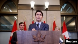 Canadian Prime Minister Justin Trudeau takes part in a press conference about the Royal Canadian Mounted Police's investigation into "violent criminal activity in Canada with connections to India," on Parliament Hill in Ottawa, Ontario, on Oct. 14, 2024.