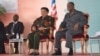 From left, Liberian Defense Minister Brownie Samukai, Liberian President Ellen Johnson Sirleaf and Ivory Coast President Alassane Ouattara attend the Joint Council of Chiefs and Elders Meeting in Guigloe, Ivory Coast, Jan. 18, 2016.