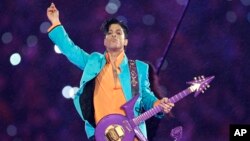 FILE - In this Feb. 4, 2007, file photo, Prince performs during the halftime show at the Super Bowl XLI football game in Miami.