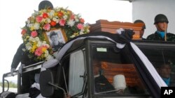 The body of Saman Gunan, a former Thai navy SEAL who died during a mission, is carried during a repatriation and religious rites ceremony at Chiang Rai Airport in Mae Sai, Chiang Rai province, in Thailand, July 6, 2018.