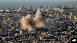 Smoke rise from Israeli airstrikes on Dahiyeh, in the southern suburb of Beirut, Lebanon, Oct. 19, 2024.