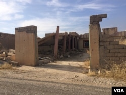 In villages like this one, besides being looted and booby-trapped, many homes and businesses, like this former bank of shops, have been destroyed, in Kazir province of Kurdistan in Iraq, Oct. 22, 2016. (H. Murdock/VOA)