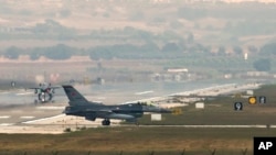 Turkish fighter jets taxi on the runway of the Incirlik airbase, southern Turkey, Aug. 31, 2013. 