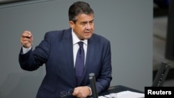 FILE - German Foreign Minister Sigmar Gabriel speaks during a session of the Bundestag, Germany's lower house of Parliament, in Berlin, Germany, Nov. 21, 2017.