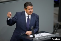 FILE - German Foreign Minister Sigmar Gabriel speaks during a session of the Bundestag, Germany's lower house of Parliament, in Berlin, Germany, Nov. 21, 2017.