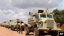 FILE - African Union soldiers stop near to Beledogle airfield, Somalia, to help secure the area from al-Shabab insurgents, Oct 11, 2012.