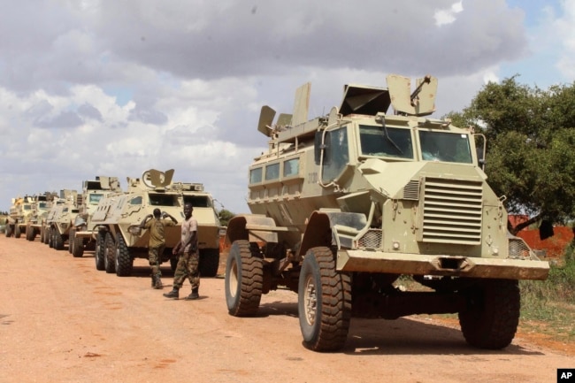 FILE - African Union soldiers stop near to Beledogle airfield, Somalia, to help secure the area from al-Shabab insurgents, Oct 11, 2012.