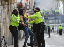 An anti-government protester is detained by police during a nationwide strike against President Lenin Moreno and his economic policies, in Quito, Ecuador, Oct. 9, 2019.