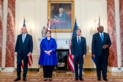 From left, Australian Minister of Defense Peter Dutton, Australian Foreign Minister Marise Payne, Secretary of State Antony Blinken, and Defense Secretary Lloyd Austin pose for a group photograph at the State Department in Washington, Thursday, Sept. 16,