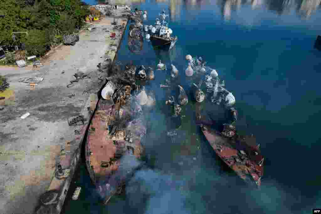 An aerial photo shows Syrian naval ships destroyed during an overnight Israeli attack on the port city of Latakia.&nbsp;The U.N. special envoy for Syria called on Israel to halt its military movements and bombardments inside Syria, days after the fall of President Bashar al-Assad. (Photo by AAREF WATAD / AFP)