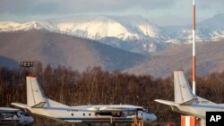 FILE - The Antonov An-26 with the same board number #RA-26085 as the missed plane is parked at Airport Elizovo outside Petropavlovsk-Kamchatsky, Russia, Nov. 17, 2020.