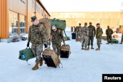 FILE - U.S. Marines, scheduled for six months of training to learn about winter warfare, arrive in Stjordal, Norway, Jan. 16, 2017.