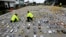 FILE - Colombian anti-narcotics policemen inspect packs of cocaine, seized from the Los Usuga criminal gang, at the police base in Necocli, Feb. 24, 2015. 