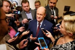 Sen. Chris Coons (D-DE) speaks with reporters on the way to the Senate floor on Capitol Hill in Washington DC, USA.