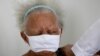 Justina Batista, 90, gets a shot of China's Sinovac vaccine in Brasilia, Brazil, Feb. 17, 2021.