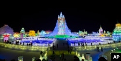 In this photo taken Wednesday, Jan. 8, 2014, people visit the Harbin International Ice and Snow Sculpture Festival in Harbin, China. (AP Photo/Vincent Thian)