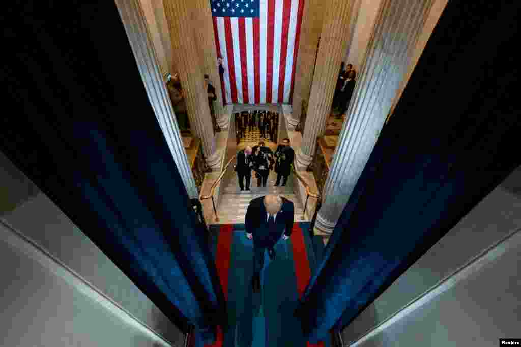 President-elect Donald J. Trump enters the stage of his inauguration as the 47th president of the United States inside the Capitol Rotunda of the U.S. Capitol building in Washington.