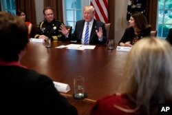 President Donald Trump speaks during a roundtable on immigration policy in California, in the Cabinet Room of the White House, May 16, 2018, in Washington.