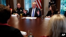 President Donald Trump speaks during a roundtable on immigration policy in California, in the Cabinet Room of the White House, May 16, 2018, in Washington. 