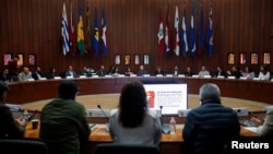 FILE - Delegates meet for a round of peace talks between Colombia's government and the National Liberation Army in Mexico City, Mexico, on Dec. 17, 2023. The government announced on Jan. 17, 2025, that it was suspending peace negotiations after violence that killed 30 people.