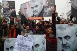 Pakistani Shi'ite Muslim protest the killing of top Iranian commander Qassem Soleimani in Iraq, outside the U.S. consulate in Lahore, Jan. 7, 2020.