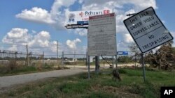 The entrance to the San Jacinto River Waste Pits site is seen, Sept. 29, 2017, in Channelview, Texas. 