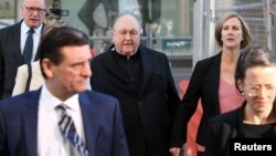 FILE - Archbishop Philip Wilson arrives at Newcastle Local Court in Newcastle, Australia, May 22, 2018. 