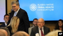 U.S. Attorney General William Barr, standing, greets participants at a roundtable discussion at the Alaska Native Tribal Health Consortium, May 29, 2019, in Anchorage, Alaska.