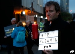 FILE -- Richard Ratcliffe husband of imprisoned charity worker Nazanin Zaghari-Ratcliffe, poses for the media during an Amnesty International led vigil outside the Iranian Embassy in London, Jan. 16, 2017.