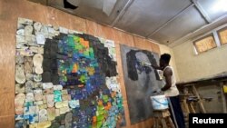 Nigerian artist Eugene Konboye creates artworks using discarded plastic flip-flop sandals in his studio in Abeokuta