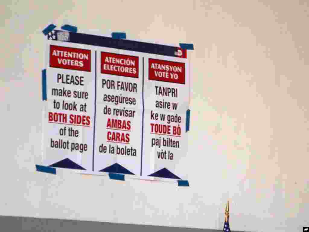 Election instructions written in English, Spanish and Creole, hang on a polling center wall in west Miami during the Republican primary election in Florida on January 31, 2012.