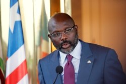 FILE - Liberia's President George Weah speaks at the Presidential palace during a visit to Abidjan, Ivory Coast, April 4, 2018.