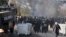 Bulgarian riot police are seen inside a refugee center during clashes in the town of Harmanli, Bulgaria, Nov. 24, 2016.  