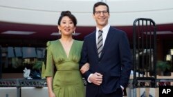 Sandra Oh, left, and Andy Samberg pose for a photo on the red carpet at the 76th Annual Golden Globe Awards Preview Day at The Beverly Hilton on Jan. 3, 2019, in Beverly Hills, California. The pair will host Sunday's event.