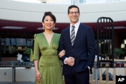 Sandra Oh, left, and Andy Samberg pose for a photo on the red carpet at the 76th Annual Golden Globe Awards Preview Day at The Beverly Hilton, Jan. 3, 2019, in Beverly Hills, California. The pair will host Sunday's event.