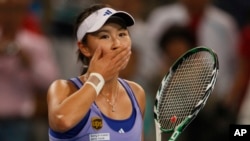 FILE - Chinese tennis player Peng Shuai reacts during a tennis match in Beijing, China on Oct. 6, 2009. (AP Photo/Ng Han Guan)