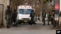 An ambulance leaves the Litoral Penitentiary after a prison riot, in Guayaquil, Ecuador, Wednesday, September 29, 2021. (AP Photo/Angel DeJesus)