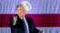 President-elect Donald Trump throws a hat into the audience while speaking at a rally at Baton Rouge (La.) Metropolitan Airport, Dec. 9, 2016.